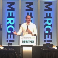 Ray Dillman-Neu speaking on stage at the MERGE! domain conference